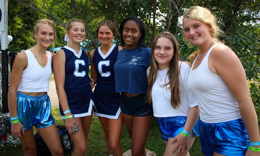 Students celebrate while on a homecoming parade float